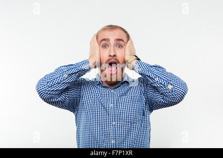 Portrait of a scared man screaming isolated on a white background Stock Photo