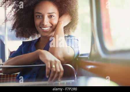 Portrait smiling woman riding bus Stock Photo