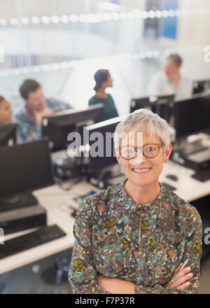 Portrait confident senior woman in adult education computer classroom Stock Photo