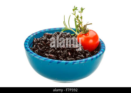 Black boiled rice with thyme Stock Photo