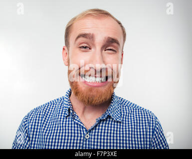 Portrait of a funny man smiling isolated on a white background Stock Photo