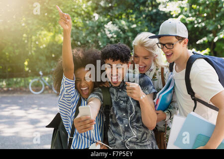 Young and enthusiastic group of university students walking and talking ...