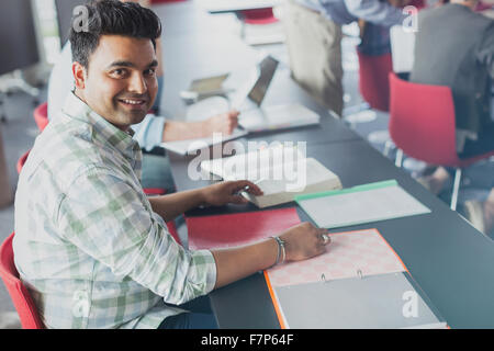 Portrait confident student in adult education classroom Stock Photo