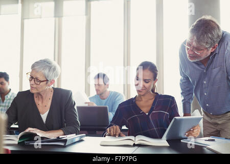 Students studying in adult education classroom Stock Photo