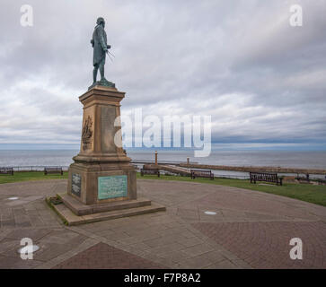 Monument to great explorer Captain James Cook on the West Cliff at Whitby,North Yorkshire,England overlooking the harbour Stock Photo