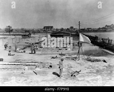 Photographic print : Site of mass burning of 250 Polish and French slave labourers at a Nazi camp near Leipzig on April 19th, 1945 the day before the city was captured by the 69th Inf. Div. First U.S. Army. The victims were herded into a building. A time bomb was exploded. Men who broke doors down to escape were machine gunned by Nazi SS troops. Stock Photo