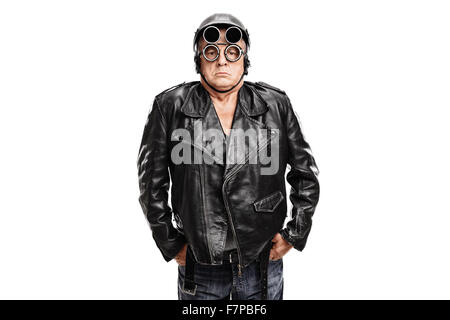 Grumpy mature motorcyclist posing in a black leather jacket with a helmet and goggles isolated on white background Stock Photo