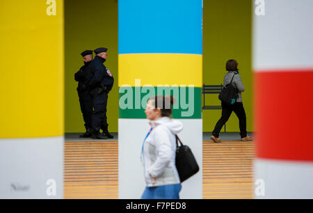 (151202) -- PARIS, Dec. 2, 2015 (Xinhua) -- Police officers patrol the site of the 2015 United Nations Climate Change Conference (COP 21) at Le Bourget on the northern suburbs of Paris, France, Dec. 2, 2015. The Paris climate talks entered stage of substantive negotiations on Tuesday as negotiators began to turn political will that their leaders expressed into concrete solutions to various disputes over a new climate agreement. Officials from 195 countries have one final week to slim the agreement draft which now runs over 50 pages to a manageable level so that their ministers could read when  Stock Photo