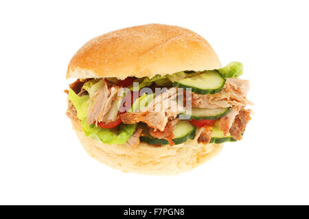 Pulled pork and salad in a soft white bread roll isolated against white Stock Photo