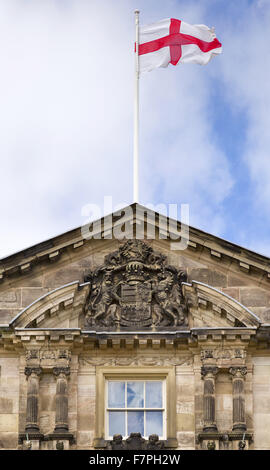 St George's flag flying above the house at Dunham Massey, Cheshire. Stock Photo