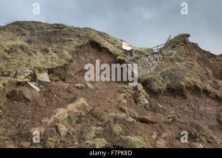 View of the storm-damaged cliffs and steps at Rhossili Bay, Gower, Swansea, Wales, pictured here in February 2014. Part of the cliff face collapsed on 22 January 2014 following erosion caused by powerful storm surges. Stock Photo