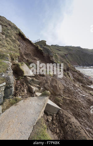 View of the storm-damaged cliffs, steps and beach at Rhossili Bay, Gower, Swansea, Wales, pictured here in February 2014. Part of the cliff face collapsed on 22 January 2014 following erosion caused by powerful storm surges. Stock Photo