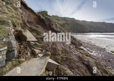 View of the storm-damaged cliffs, steps and beach at Rhossili Bay, Gower, Swansea, Wales, pictured here in February 2014. Part of the cliff face collapsed on 22 January 2014 following erosion caused by powerful storm surges. Stock Photo