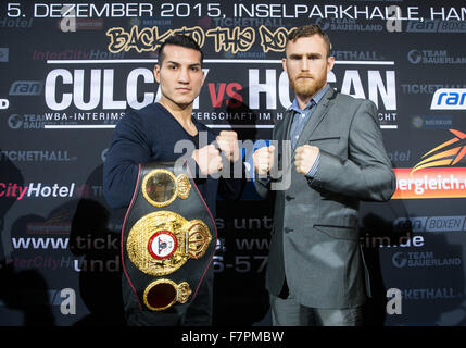 Hamburg, Germany. 02nd Dec, 2015. German boxer Jack Culcay (L) and his Irish contender Dennis Hogan pose after a press conference in Hamburg, Germany, 02 December 2015. Germany's Jack Culcay is due to face Ireland's Dennis Hogan in a WBA world super Welterweight bout on 05 December 2015. Photo: CHRISTIAN CHARISIUS/dpa/Alamy Live News Stock Photo