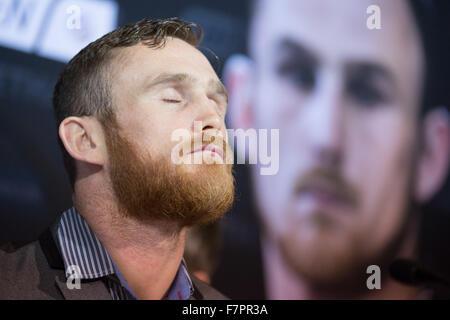 Hamburg, Germany. 02nd Dec, 2015. Irish boxer Dennis Hogan closes his eyes as he attends a press conference in Hamburg, Germany, 02 December 2015. Germany's Jack Culcay is due to face Ireland's Dennis Hogan in a WBA world super Welterweight bout on 05 December 2015. Photo: CHRISTIAN CHARISIUS/dpa/Alamy Live News Stock Photo