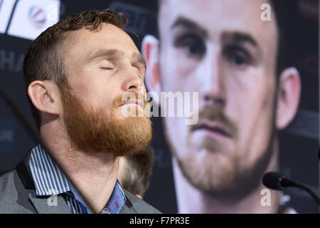 Hamburg, Germany. 02nd Dec, 2015. Irish boxer Dennis Hogan closes his eyes as he attends a press conference in Hamburg, Germany, 02 December 2015. Germany's Jack Culcay is due to face Ireland's Dennis Hogan in a WBA world super Welterweight bout on 05 December 2015. Photo: CHRISTIAN CHARISIUS/dpa/Alamy Live News Stock Photo