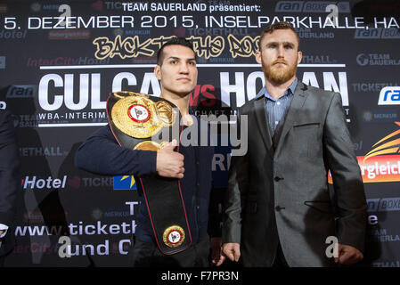 Hamburg, Germany. 02nd Dec, 2015. German boxer Jack Culcay (L) and his Irish contender Dennis Hogan pose after a press conference in Hamburg, Germany, 02 December 2015. Germany's Jack Culcay is due to face Ireland's Dennis Hogan in a WBA world super Welterweight bout on 05 December 2015. Photo: CHRISTIAN CHARISIUS/dpa/Alamy Live News Stock Photo