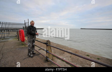 Well known fisherman Steve Homewood at Newhaven Harbour with rod and line Stock Photo