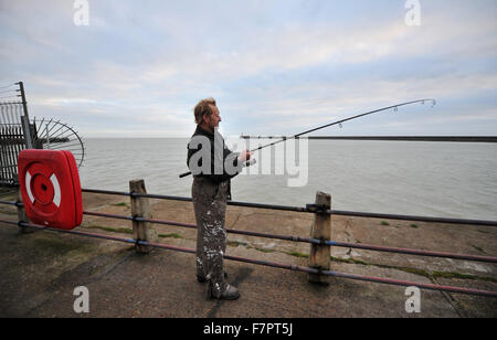 Well known fisherman Steve Homewood at Newhaven Harbour with rod and line Stock Photo