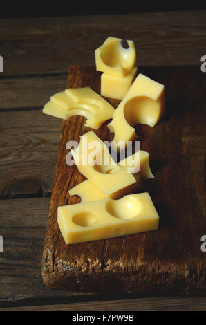 pieces and slices of fresh emmental cheese Stock Photo