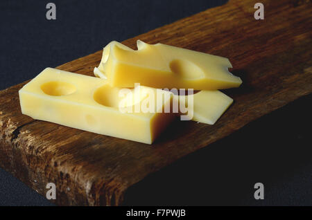 pieces and slices of fresh emmental cheese Stock Photo