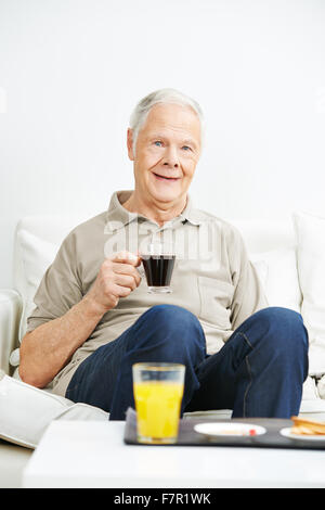 Old man drinking coffee for breakfast in a nursing home Stock Photo