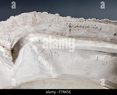 Dinner plate, probably Frederick Kandler, c. 1751, silver at Ickworth, Suffolk. Detail of distorted engraving on reverse. National Trust Inventory number 852124.12. Stock Photo