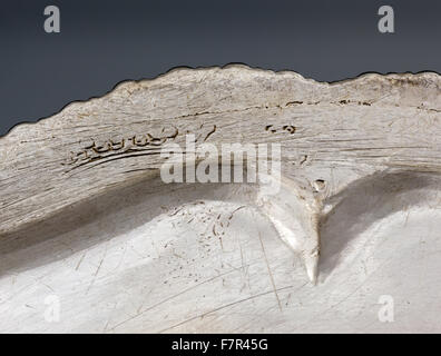 Dinner plate, probably Frederick Kandler, c. 1751, silver at Ickworth, Suffolk. Detail of distorted engraving on reverse. National Trust Inventory number 852124.9. Stock Photo