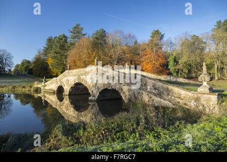 The Oxford Bridge in the autumn at Stowe, Buckinghamshire. Stowe is a landscaped garden with picture-perfect views, winding paths, lakeside walks and classical temples. Stock Photo