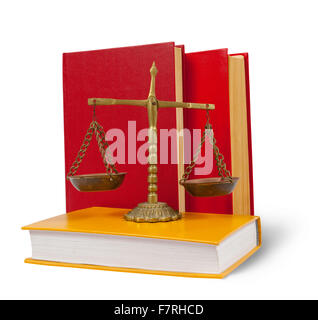 Brass scales of justice atop legal books over white Stock Photo