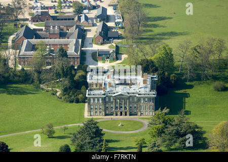 An aerial view of Calke Abbey, Derbyshire. There are beautiful, yet faded, walled gardens and the orangery, auricula theatre and kitchen gardens to explore. Stock Photo