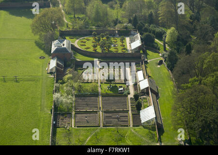 An aerial view of Calke Abbey, Derbyshire. There are beautiful, yet faded, walled gardens and the orangery, auricula theatre and kitchen gardens to explore. Stock Photo