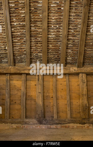 Inside Grange Barn, Essex. One of Europe's oldest timber-framed buildings, Grange Barn stands as a lasting reminder of the once powerful Coggeshall Abbey. Stock Photo