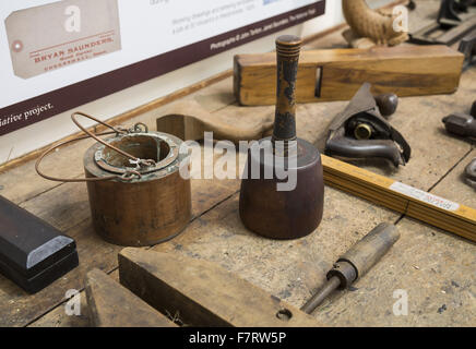 Tools at Grange Barn, Essex. One of Europe's oldest timber-framed buildings, Grange Barn stands as a lasting reminder of the once powerful Coggeshall Abbey. Stock Photo