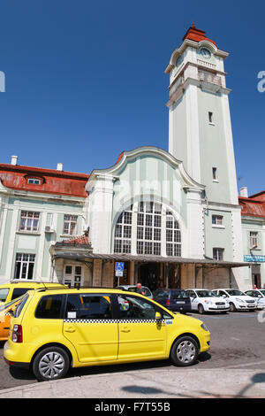 Burgas, Bulgaria - July 23, 2014: Yellow taxi car parked near the central passenger railway station of Burgas Stock Photo
