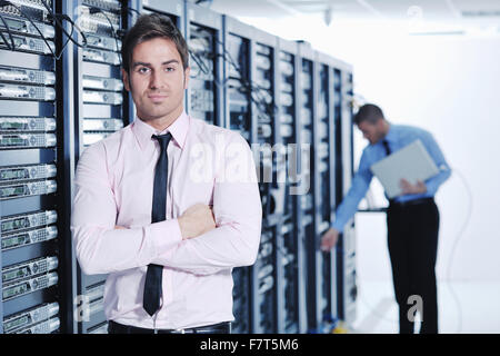 group of young business people it engineer in network server room solving problems and give help and support Stock Photo