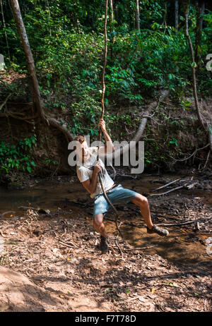 Woman, the Tourist, Shakes on a Liana As on a Swing on Beng Mealea