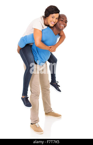 playful African American couple piggyback on white background Stock Photo