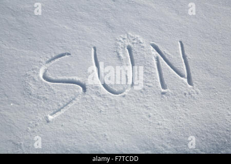 The word SUN written in the snow Stock Photo