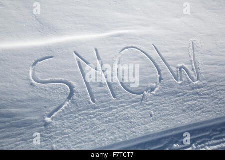 The word SNOW written in the snow Stock Photo