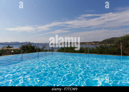 Swimming pool with view on the coast in Sardinia Stock Photo