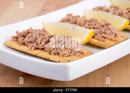 Tuna meat on crackers as snack or appetizer Stock Photo