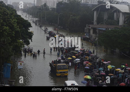 Chennai, Indian state Tamil Nadu. 2nd Dec, 2015. People wade through a water-logged road in Chennai, capital of southern Indian state Tamil Nadu, on Dec. 2, 2015. Chennai is reeling under fresh heavy rains, with large parts of the city completely inundated, flights and trains suspended and hundreds of people left without power. A senior Indian weather official said Wednesday that heavy showers are likely to continue in Chennai for another week. © Stringer/Xinhua/Alamy Live News Stock Photo