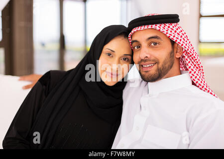 cute young Muslim married couple relaxing at home Stock Photo