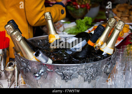 Bottles of sparkling wine in a tub with ice Stock Photo