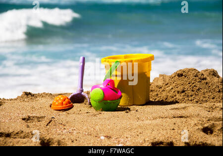 Summer beach toys in the sand. Stock Photo