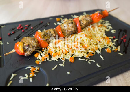 Chicken shish kebab and rice with vegetables Stock Photo