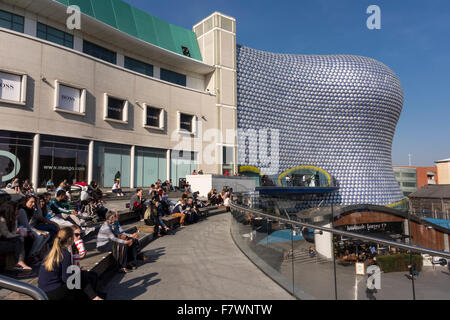 People enjoying sunny afternoon in Bullring shopping district of Birmingham, UK Stock Photo