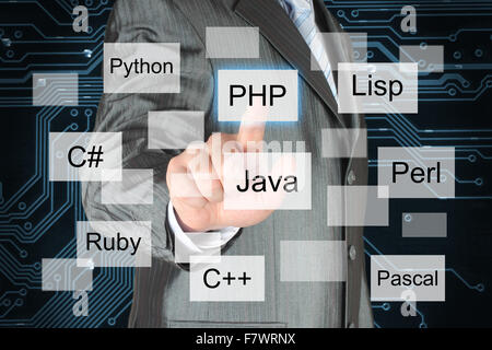 Man pushing virtual programming language button on digital background Stock Photo