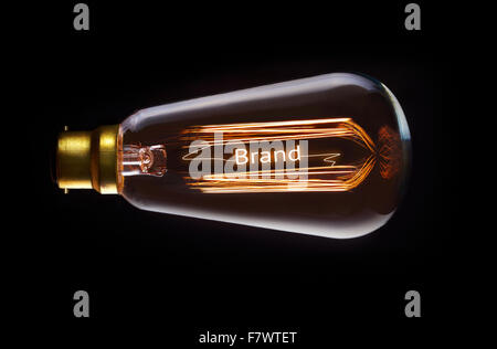 Brand concept in a filament lightbulb. Stock Photo